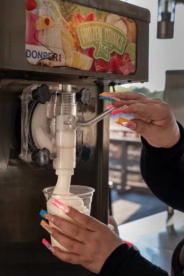 A frozen drink being poured at the Paradise Live bar